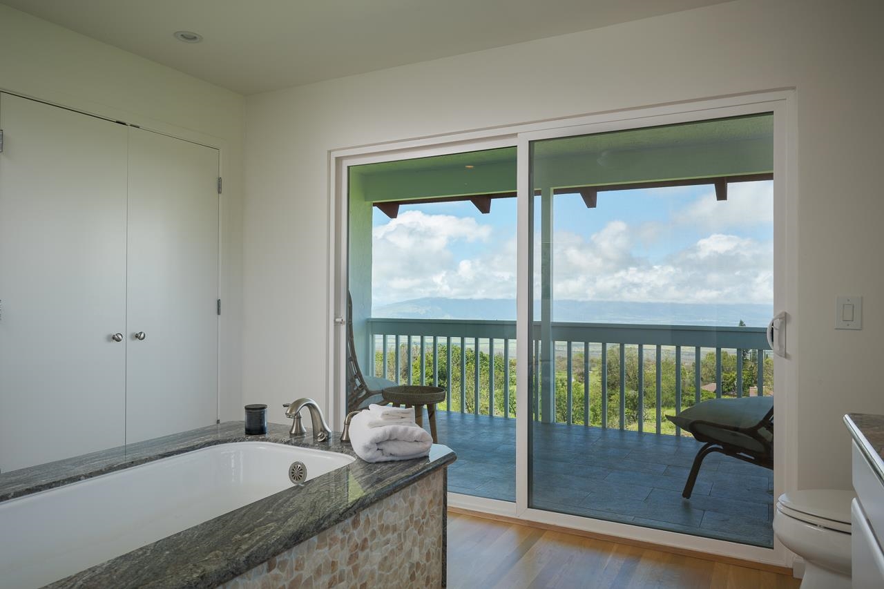 Undisclosed Address Kula, HI 96790 - Photo 21 of 50 a bathroom with a tub and a large window