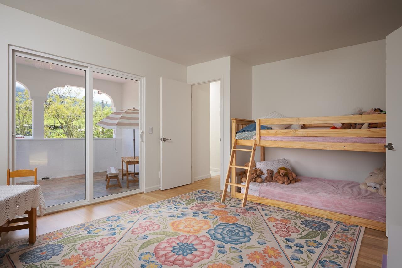 Undisclosed Address Kula, HI 96790 - Photo 22 of 50 a bedroom with a bed and wooden floor