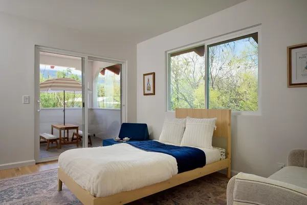a bedroom with a large bed and a window