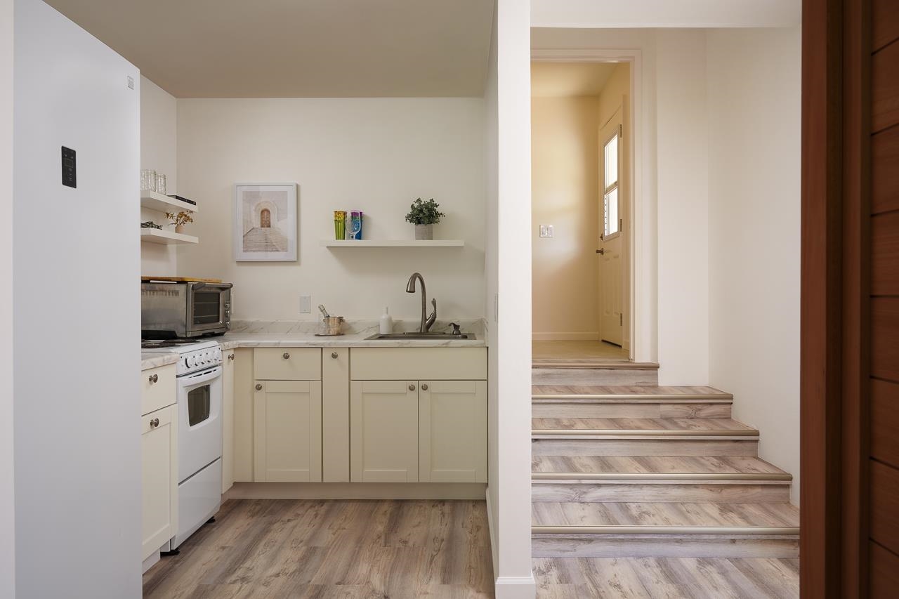 Undisclosed Address Kula, HI 96790 - Photo 28 of 50 a kitchen with cabinets and wooden floor