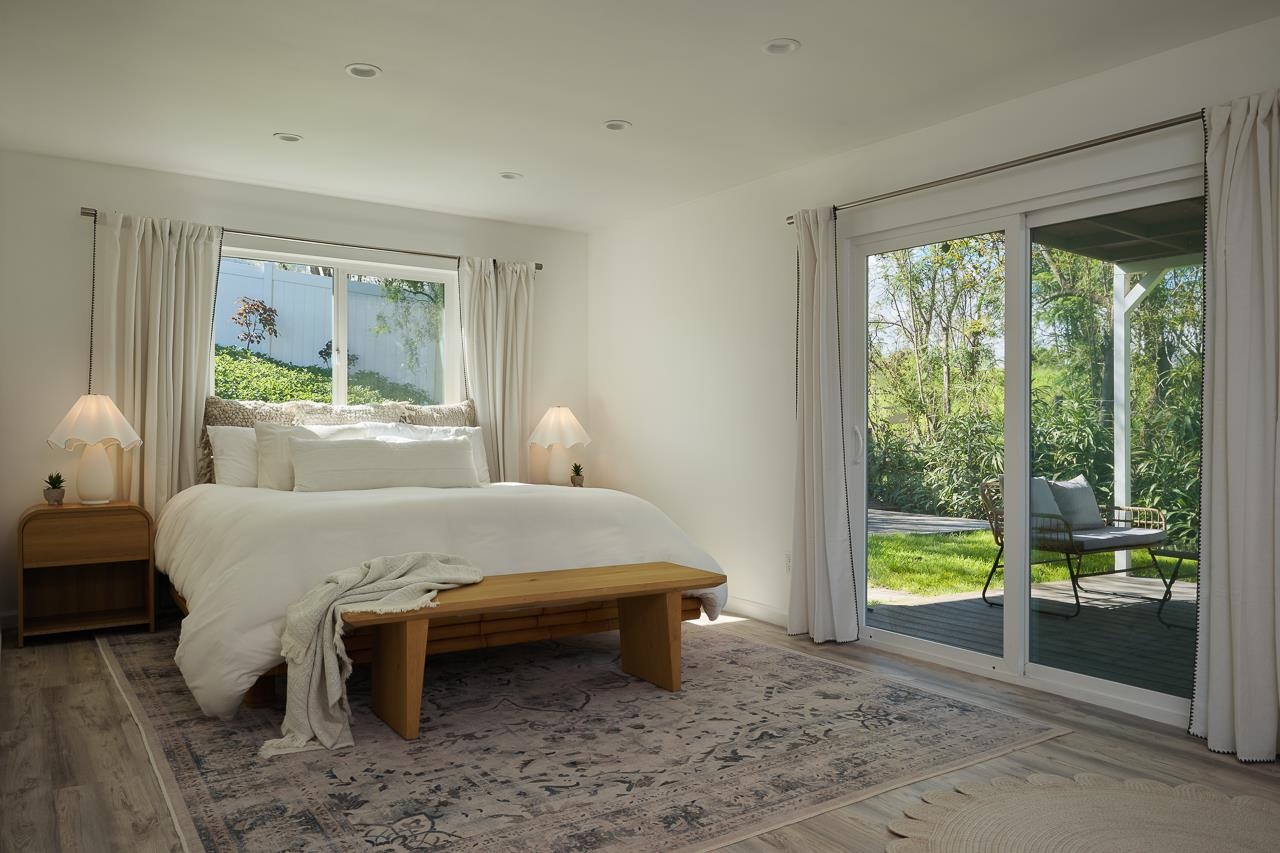 Undisclosed Address Kula, HI 96790 - Photo 31 of 50 a bedroom with a bed and a large window