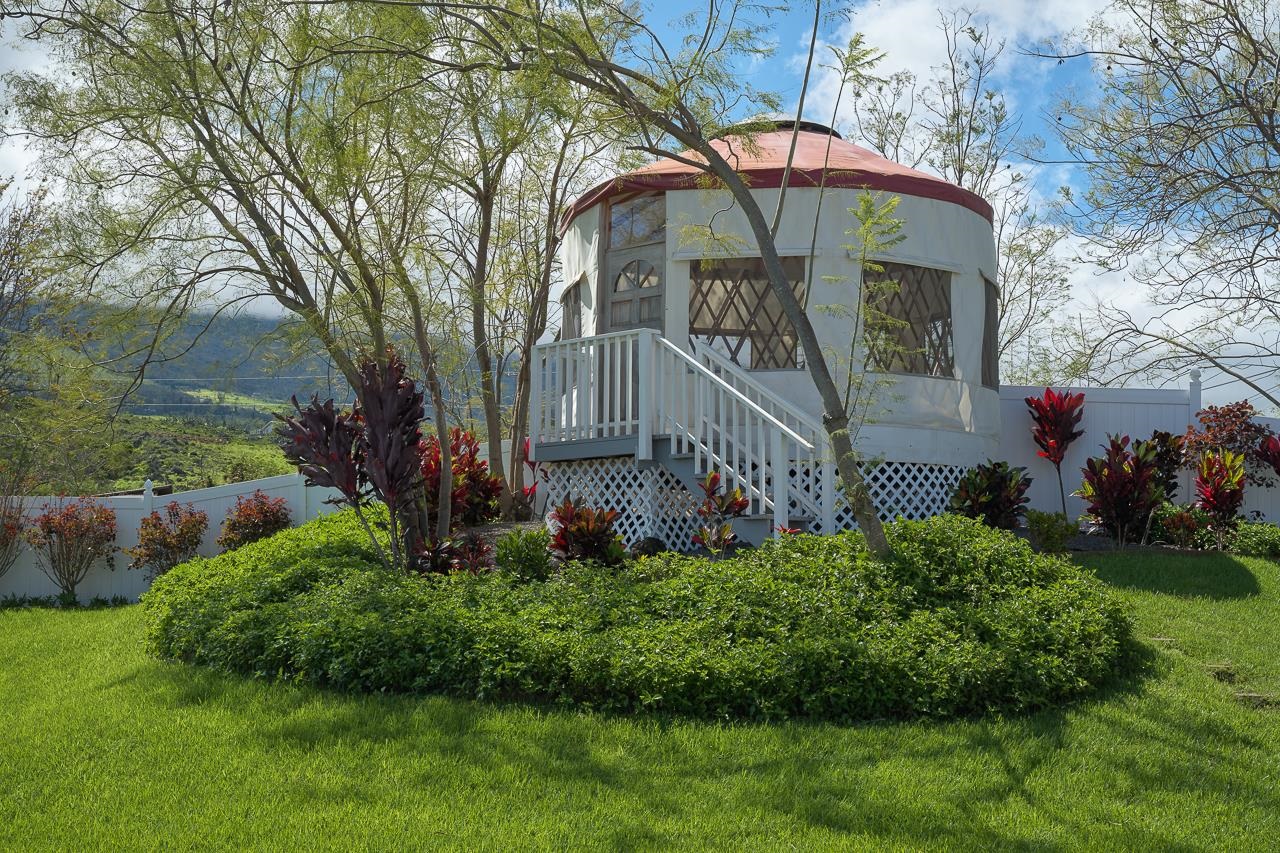 Undisclosed Address Kula, HI 96790 - Photo 34 of 50 a front view of a house with garden