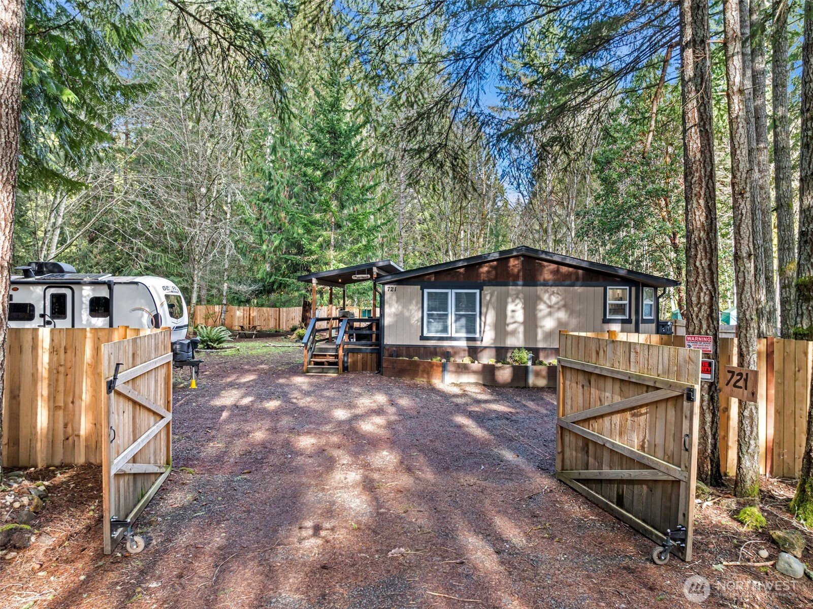 721 East McMickin Road Shelton, WA 98584 - Photo 1 of 38 a view of a house with backyard and sitting area