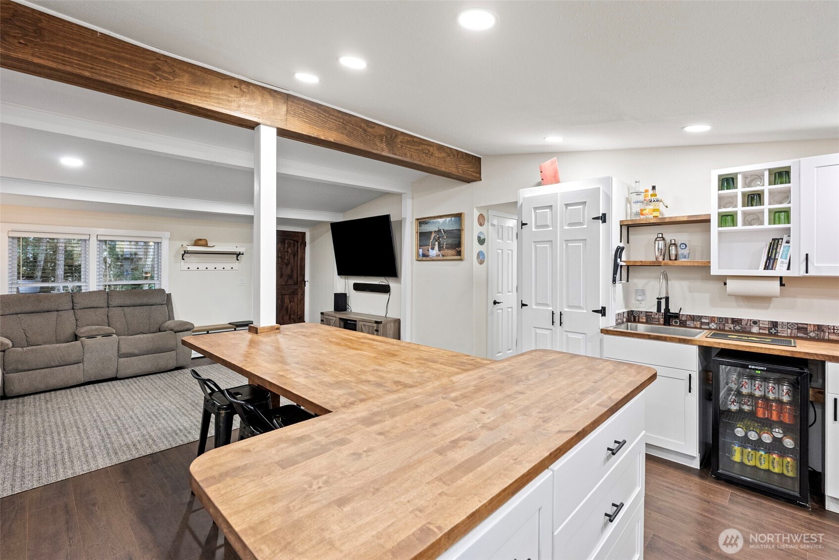 721 East McMickin Road Shelton, WA 98584 - Photo 14 of 38 a kitchen with stainless steel appliances granite countertop a stove top oven a sink dishwasher and white cabinets with wooden floor