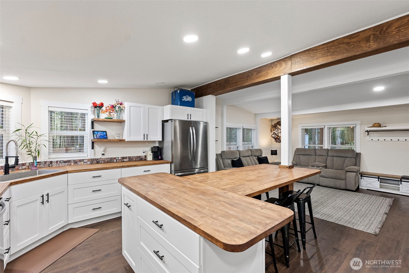 721 East McMickin Road Shelton, WA 98584 - Photo 15 of 38 a kitchen with granite countertop a sink appliances and white cabinets