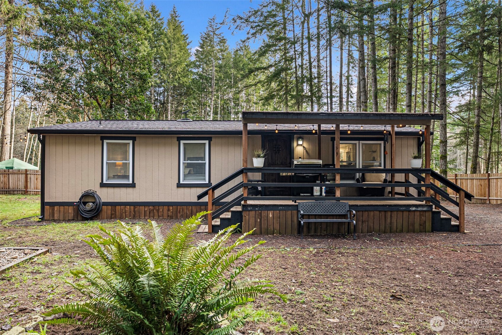 721 East McMickin Road Shelton, WA 98584 - Photo 5 of 38 a view of a house with backyard and sitting area