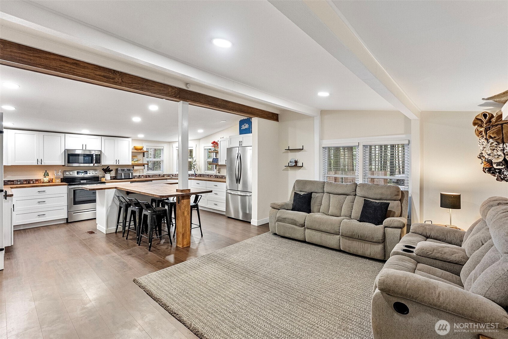 721 East McMickin Road Shelton, WA 98584 - Photo 8 of 38 a living room kitchen with furniture and a table