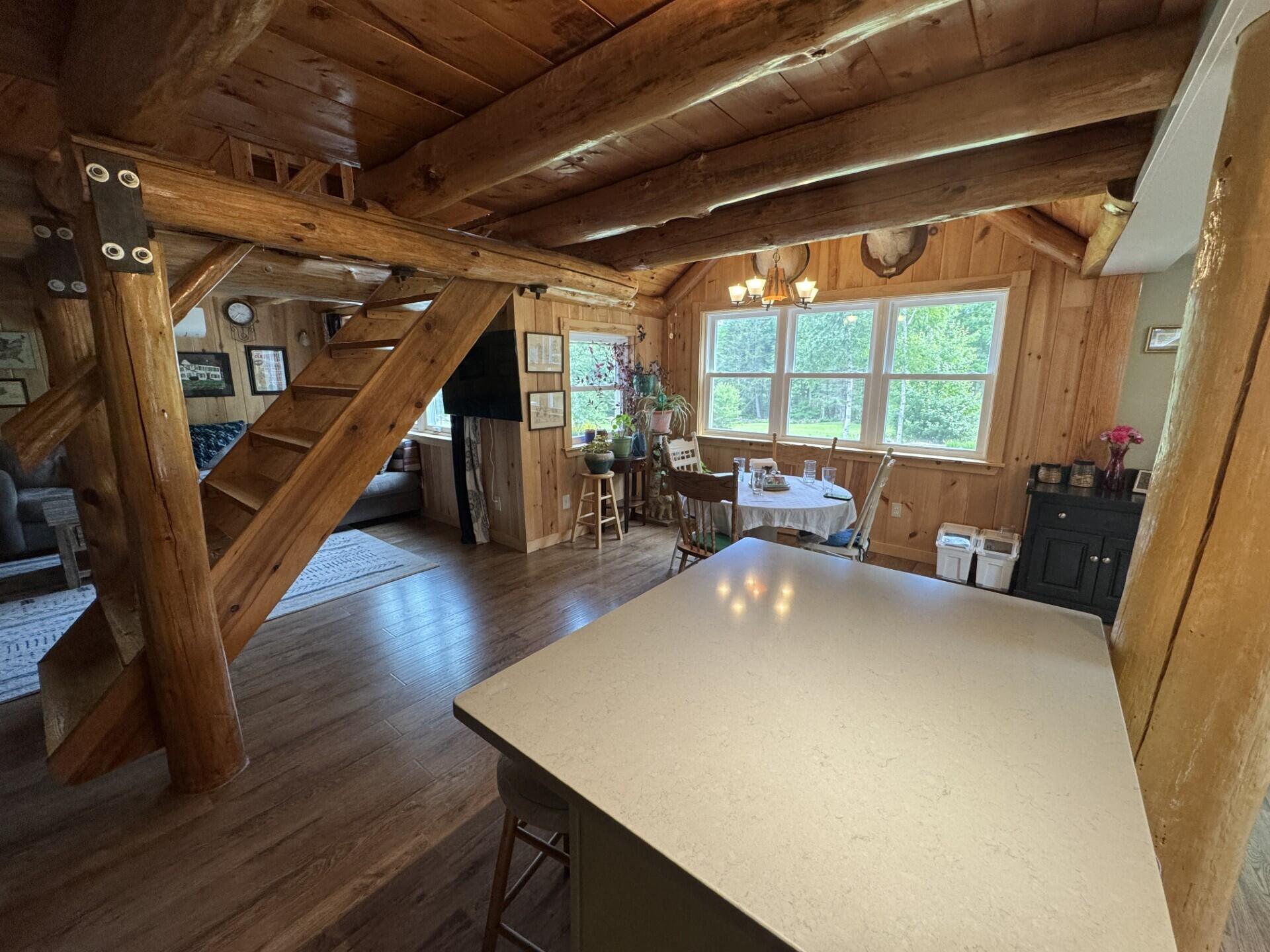 71 Garland Road Dixmont, ME 04932 - Photo 15 of 23 Kitchen island to living room