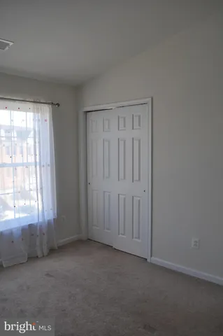 a bathroom with a granite countertop toilet a sink and a bathtub