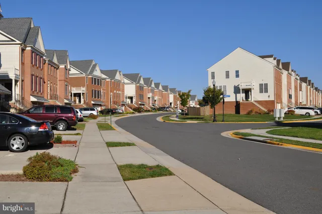 a view of city street with tall buildings