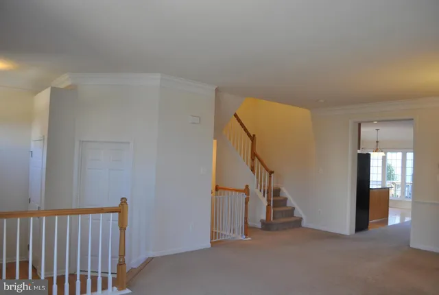 a view of a hallway with staircase
