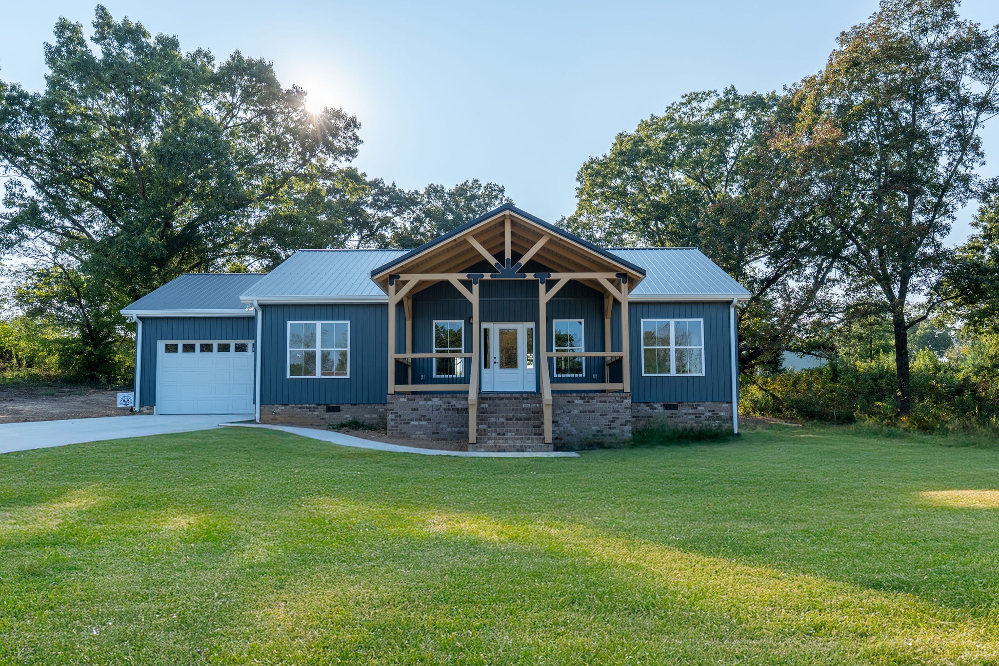 1166 Dugout Road Summertown, TN 38483 - Photo 1 of 24 a front view of a house with a yard