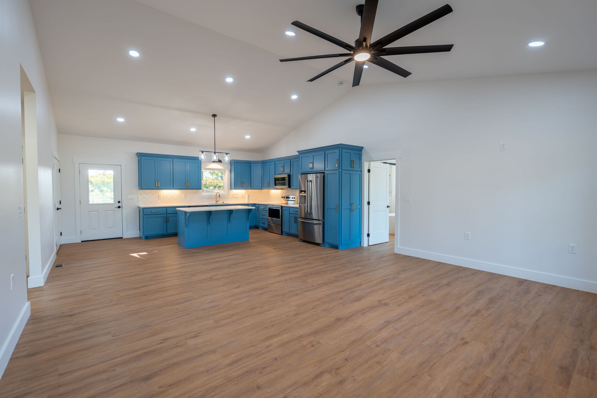 1166 Dugout Road Summertown, TN 38483 - Photo 7 of 24 a view of kitchen and stainless steel appliances with wooden floor