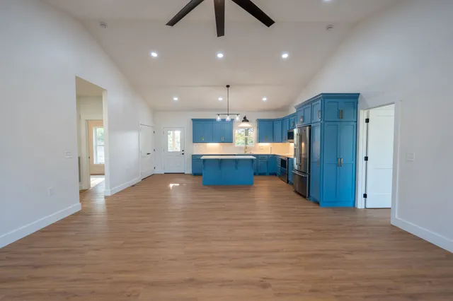 a view of kitchen with a sink and cabinet