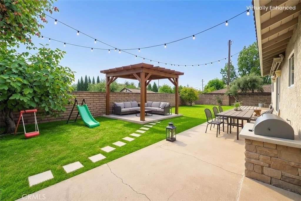 8216 Sheffield Road San Gabriel, CA 91775 - Photo 8 of 53 a view of a garden with a slide and a table