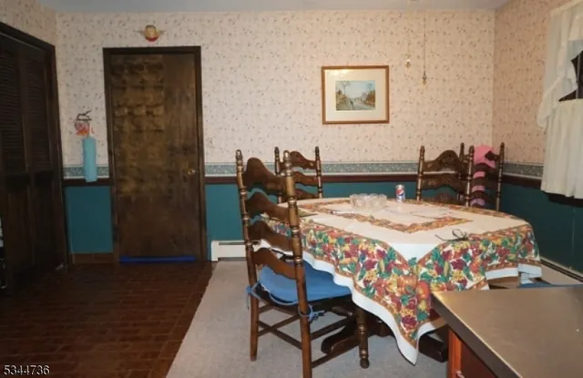 a bedroom with a bed a table and chair