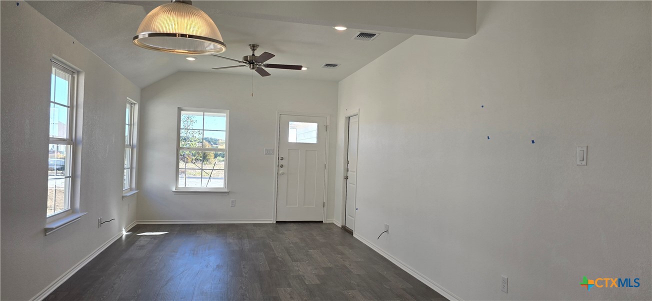 342 Monty Road Copperas Cove, TX 76522 - Photo 2 of 15 a view of an empty room with wooden floor and a window