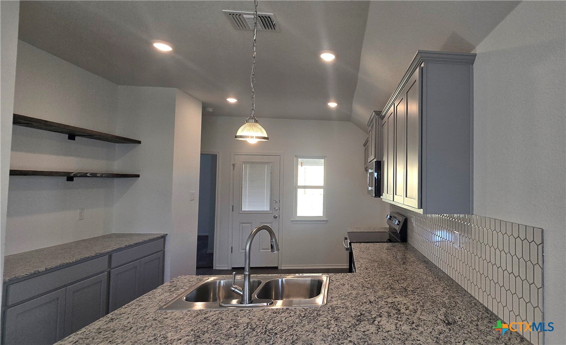 342 Monty Road Copperas Cove, TX 76522 - Photo 4 of 15 a kitchen with sink cabinets and window