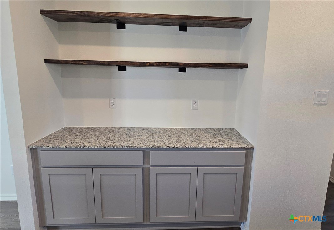 342 Monty Road Copperas Cove, TX 76522 - Photo 8 of 15 a bathroom with a granite countertop sink and vanity