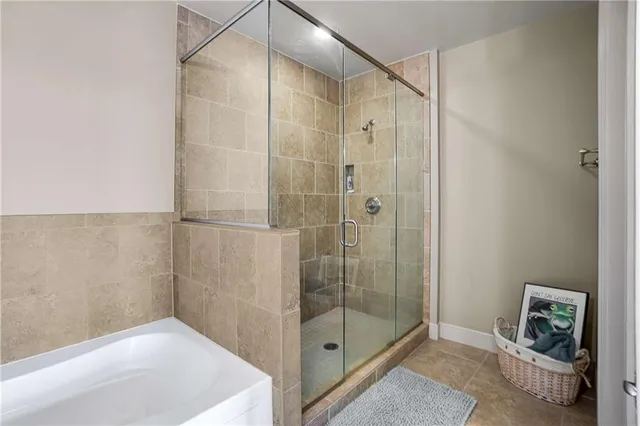 a bathroom with a shower and a sink