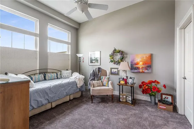 a bedroom with bed and a chandelier