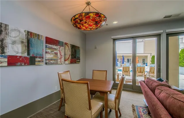 an aerial view of a house with garden space and swimming pool