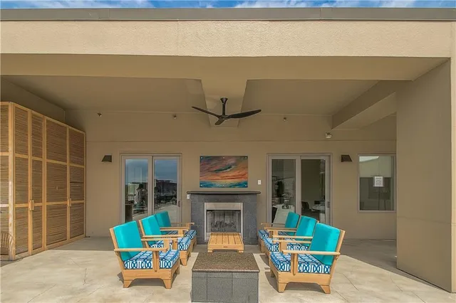 a view of a swimming pool with chairs and tables