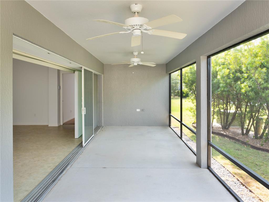 3942 Zenith Loop The Villages, FL 32163 - Photo 15 of 31 wooden floor in an empty room with a window