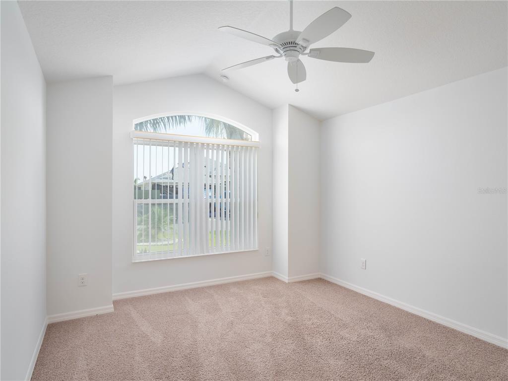 3942 Zenith Loop The Villages, FL 32163 - Photo 21 of 31 an empty room with a empty space and a ceiling fan