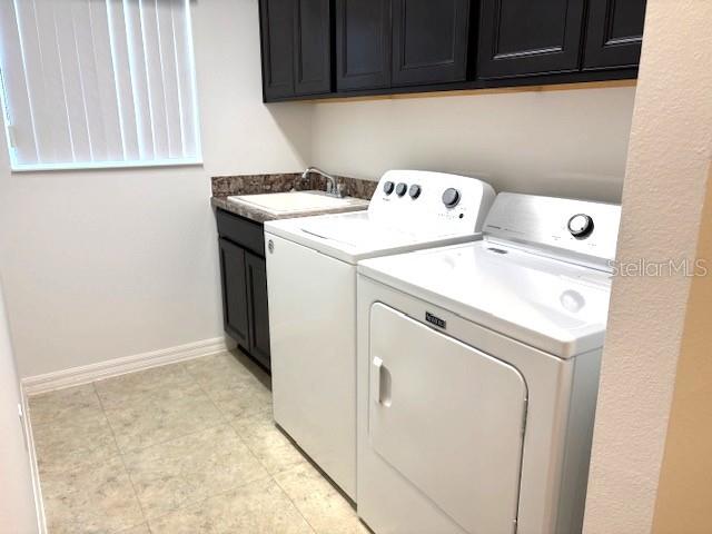 3942 Zenith Loop The Villages, FL 32163 - Photo 27 of 31 a utility room with dryer and washer