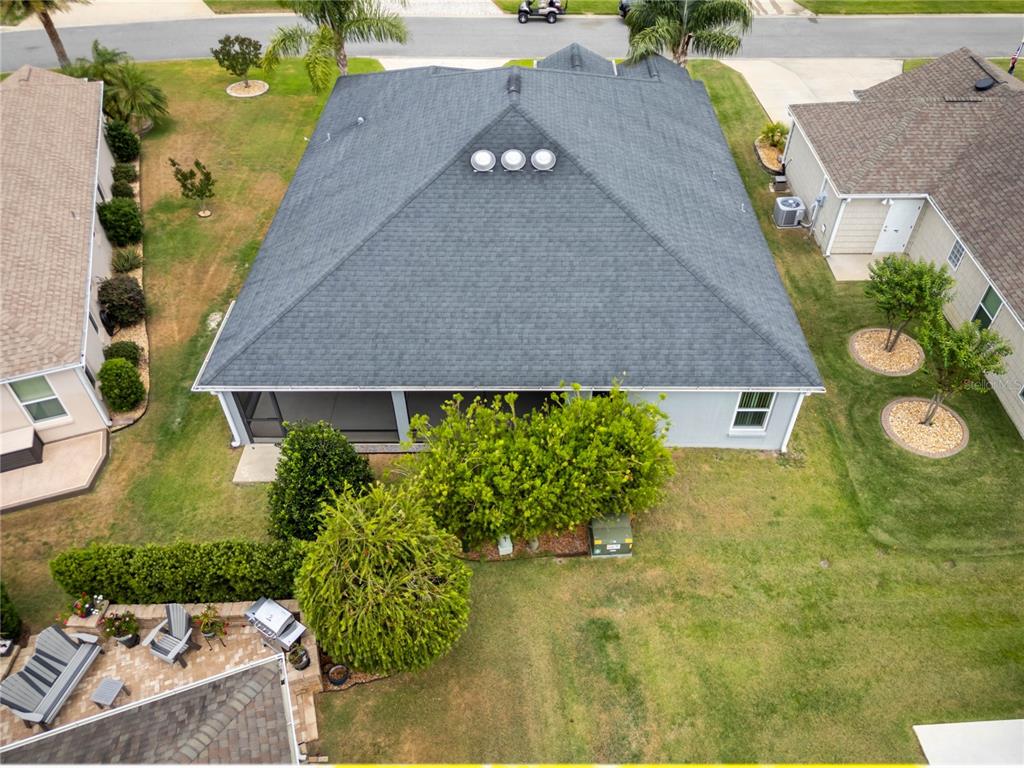 3942 Zenith Loop The Villages, FL 32163 - Photo 3 of 31 an aerial view of a house with swimming pool garden and patio