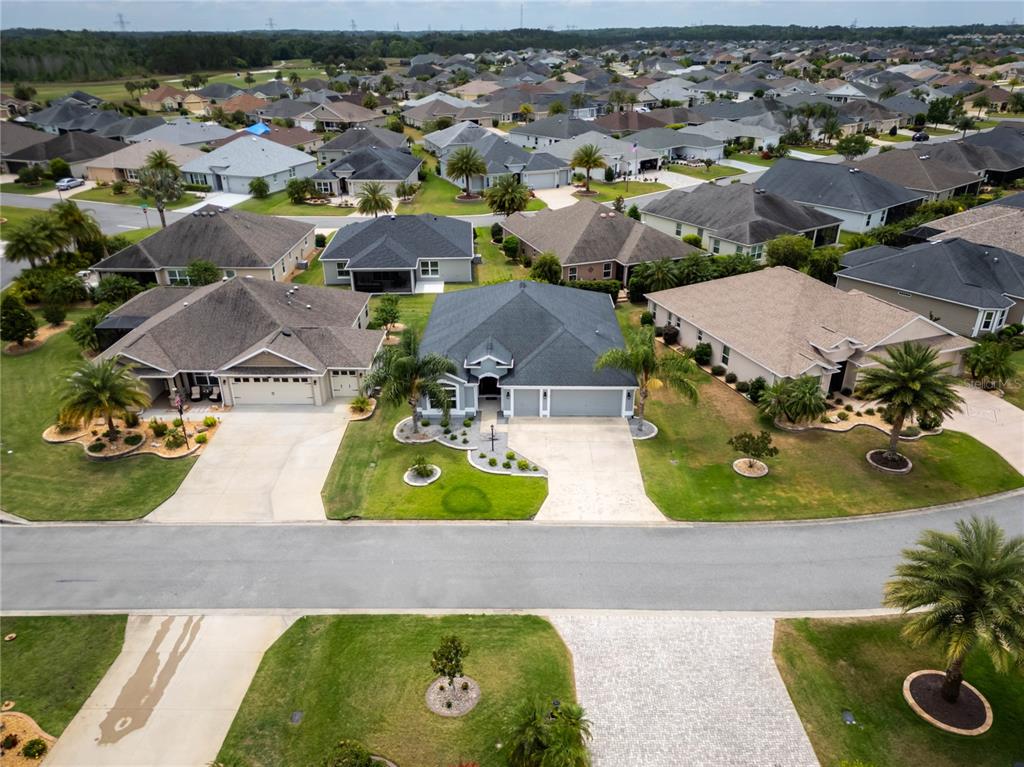 3942 Zenith Loop The Villages, FL 32163 - Photo 4 of 31 an aerial view of residential houses with outdoor space and parking