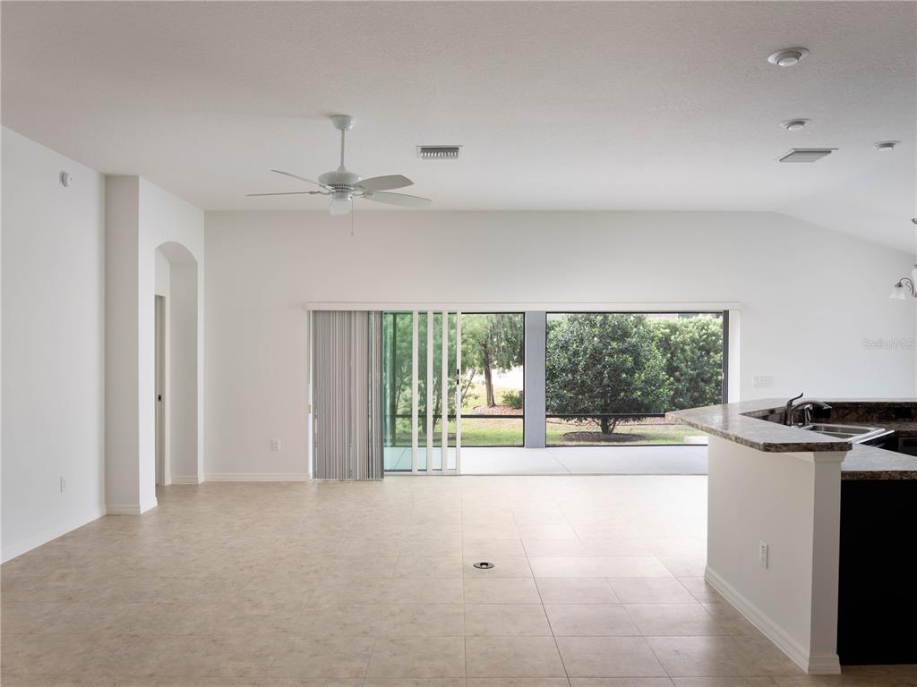 3942 Zenith Loop The Villages, FL 32163 - Photo 8 of 31 a view of a kitchen with a sink and a window