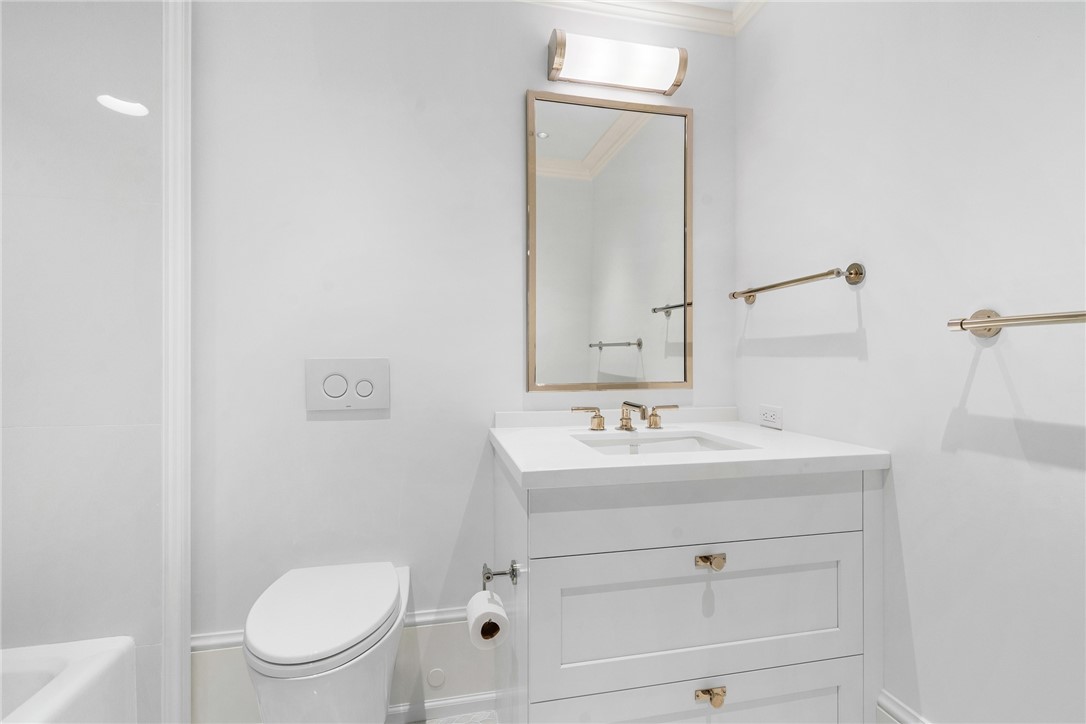 800 Beach Road, Unit 372 Indian River Shores, FL 32963 - Photo 20 of 35 a bathroom with a toilet a sink a mirror and vanity