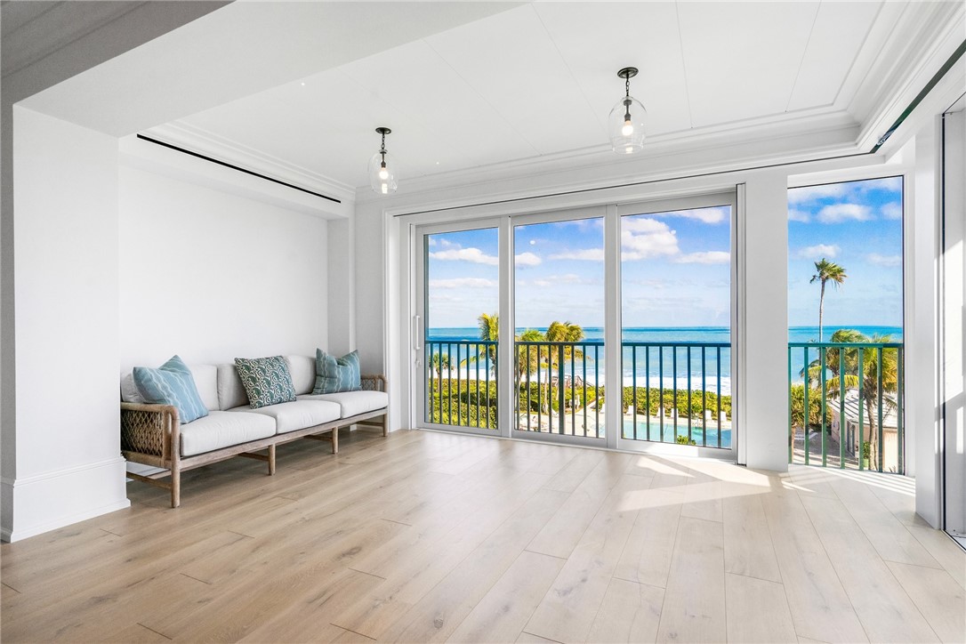 800 Beach Road, Unit 372 Indian River Shores, FL 32963 - Photo 2 of 35 a living room with furniture and a large window