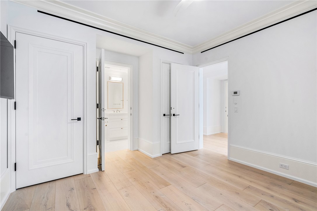 800 Beach Road, Unit 372 Indian River Shores, FL 32963 - Photo 21 of 35 a view of a hallway with wooden floor and a bathroom