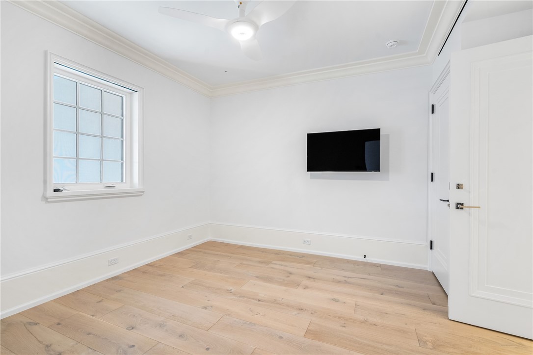 800 Beach Road, Unit 372 Indian River Shores, FL 32963 - Photo 22 of 35 an empty room with wooden floor and windows