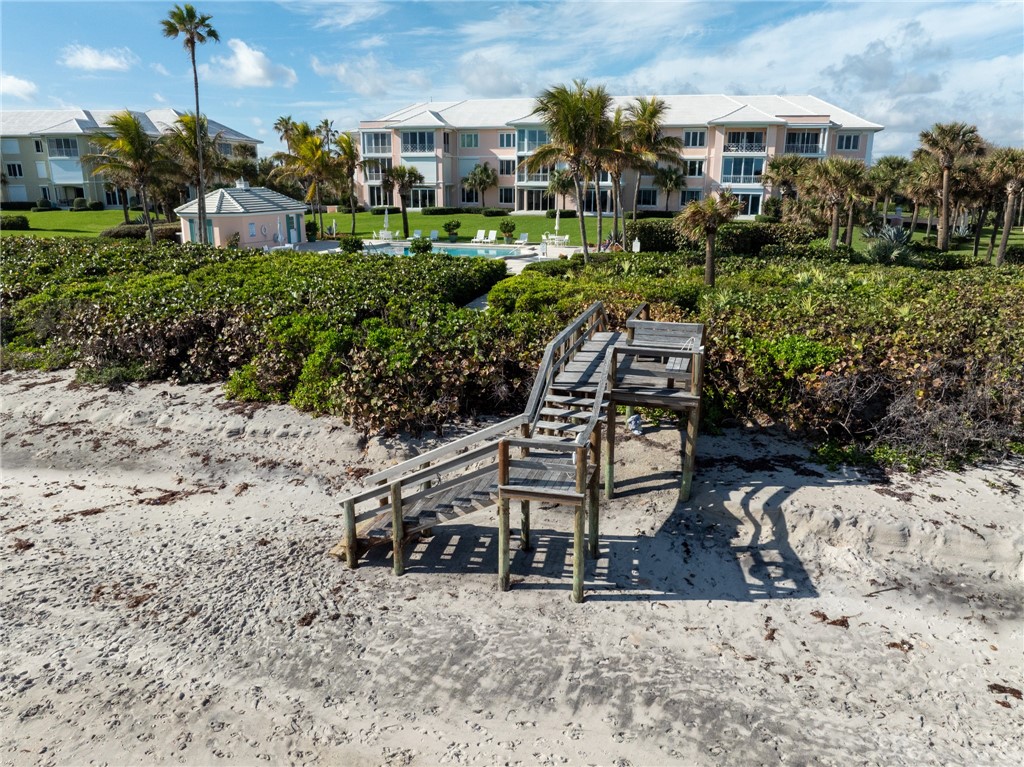 800 Beach Road, Unit 372 Indian River Shores, FL 32963 - Photo 29 of 35 a front view of a house with a yard