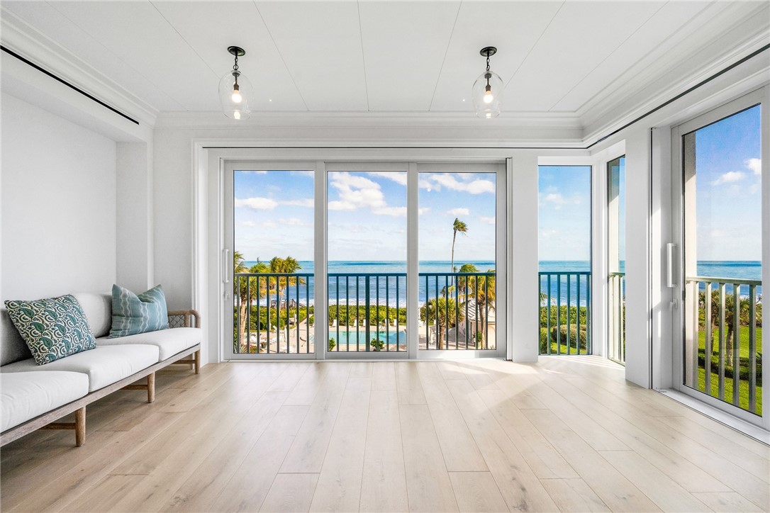 800 Beach Road, Unit 372 Indian River Shores, FL 32963 - Photo 5 of 35 a living room with furniture and a large window