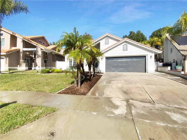 a kitchen with granite countertop a sink a microwave and cabinets