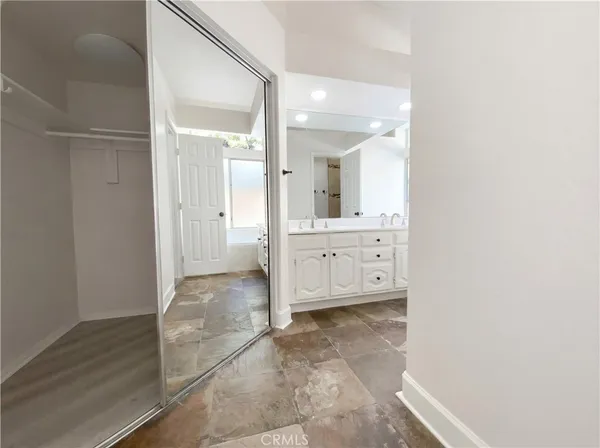 a view of a bathroom with sink and mirror