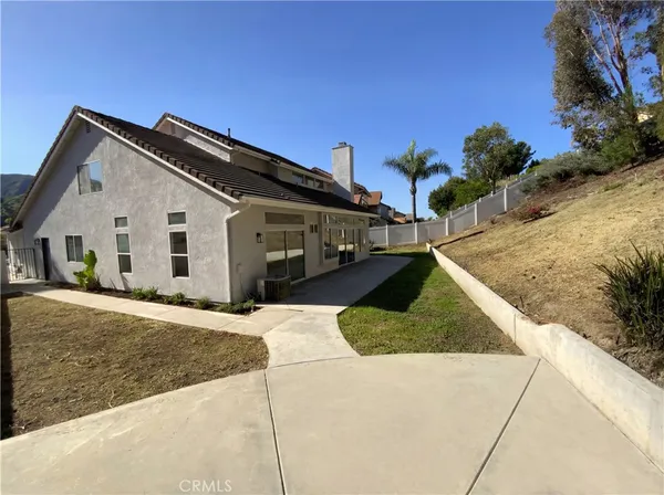 a view of house and center with street