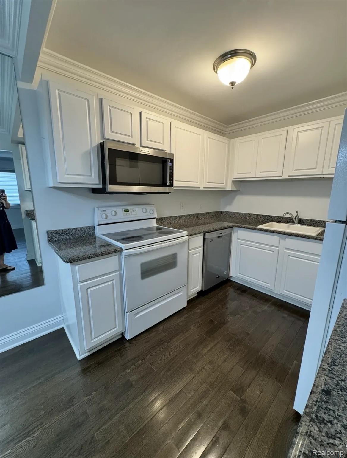 2247 Walton Blvd. Rochester, MI 48309 - Photo 6 of 12 Kitchen featuring white cabinetry, dark wood-finish flooring, and speckled countertops