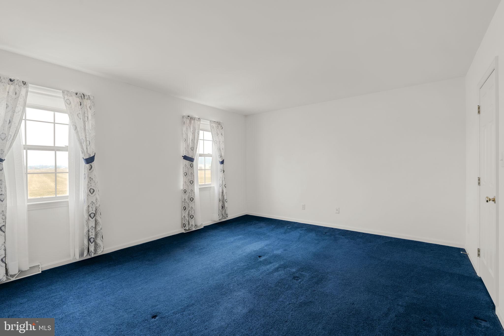 136 Bridle Path New Holland, PA 17557 - Photo 17 of 38 an empty room with wooden floor and windows