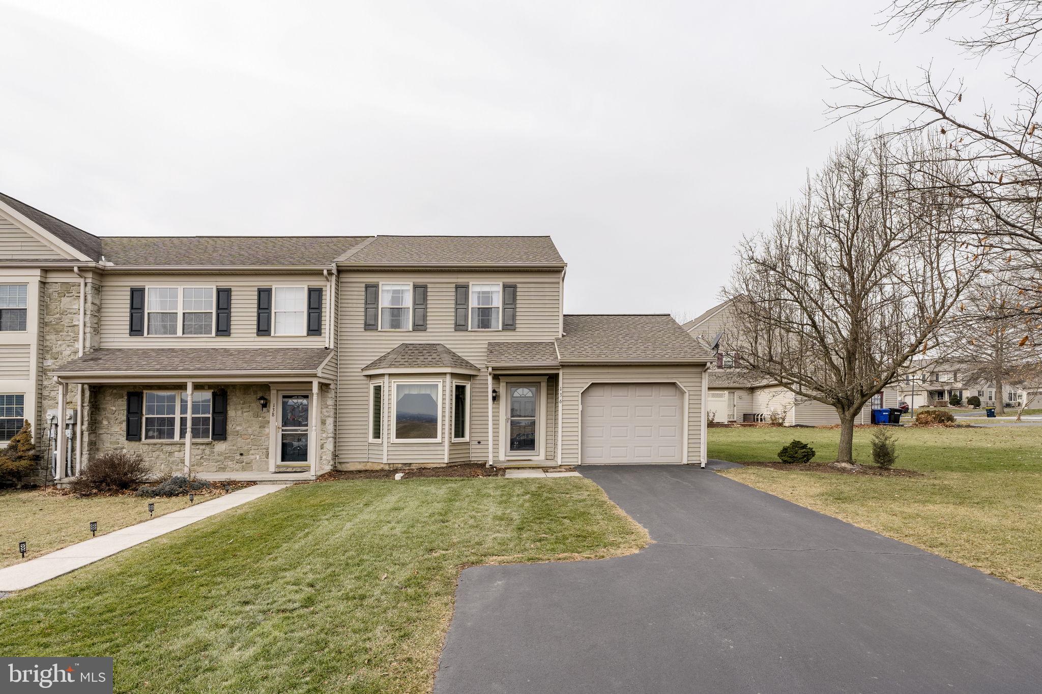 136 Bridle Path New Holland, PA 17557 - Photo 27 of 38 a front view of a house with a yard and garage
