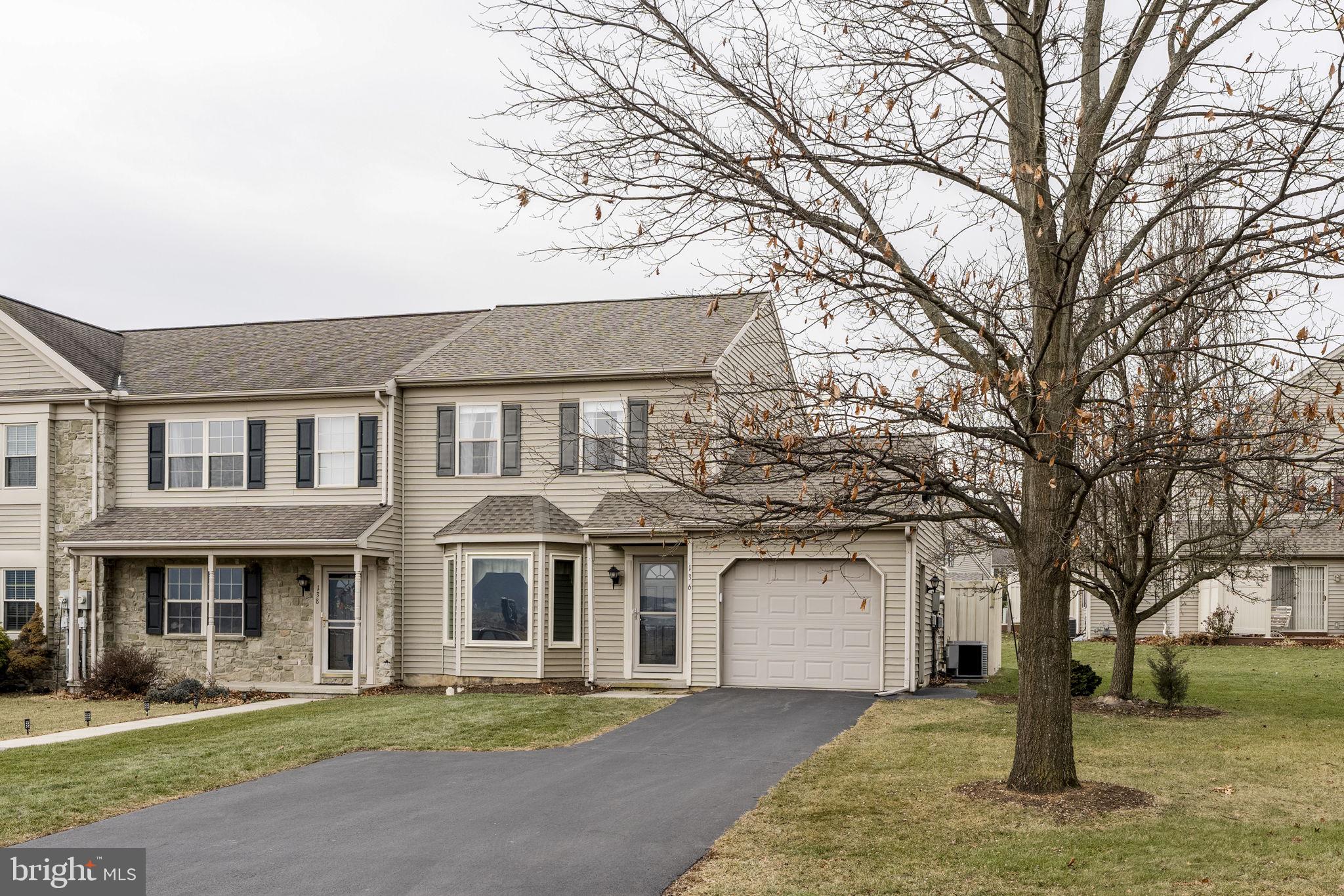 136 Bridle Path New Holland, PA 17557 - Photo 28 of 38 a front view of a house with a garden and trees