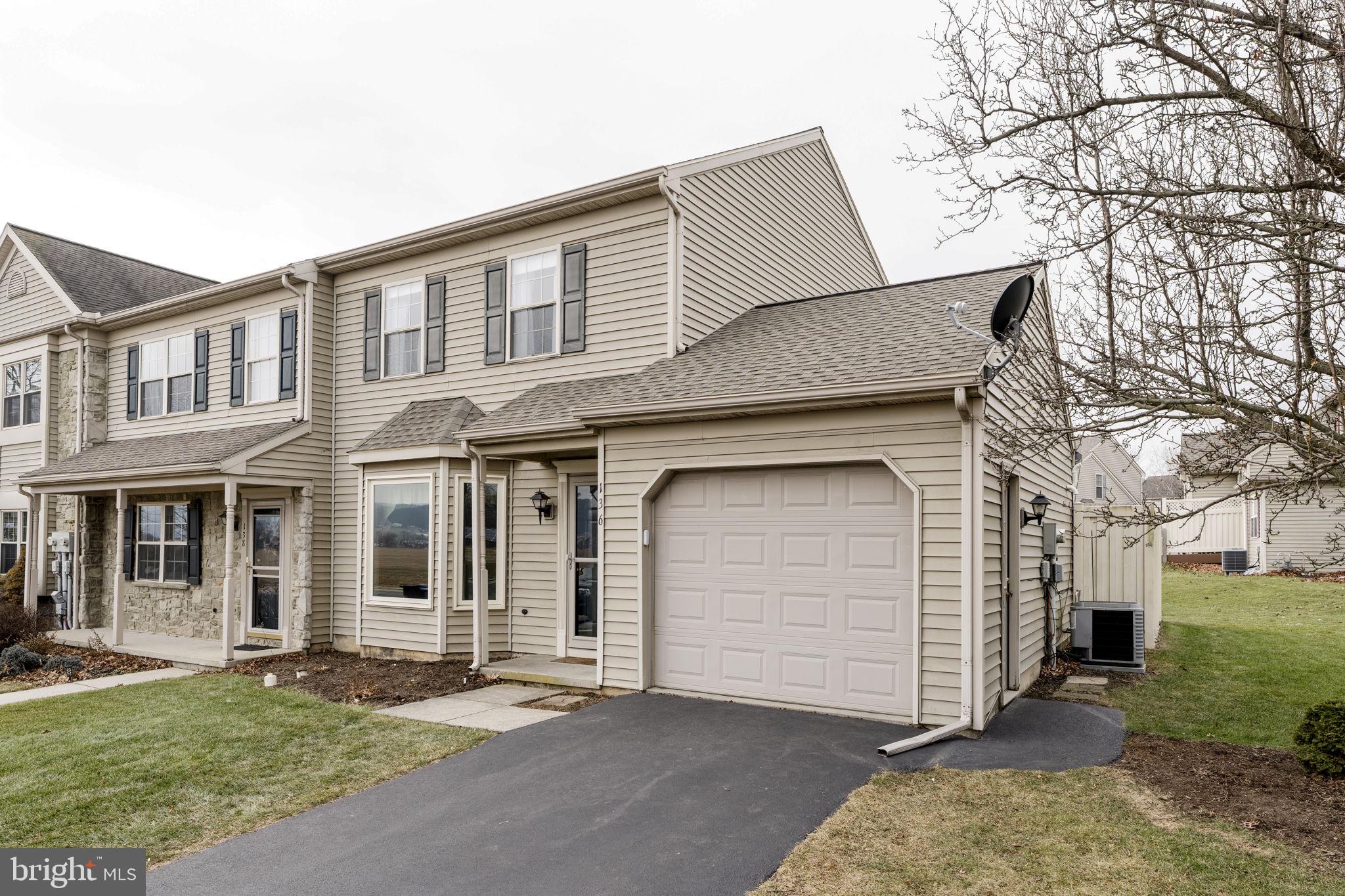 136 Bridle Path New Holland, PA 17557 - Photo 29 of 38 a front view of a house with a yard and garage