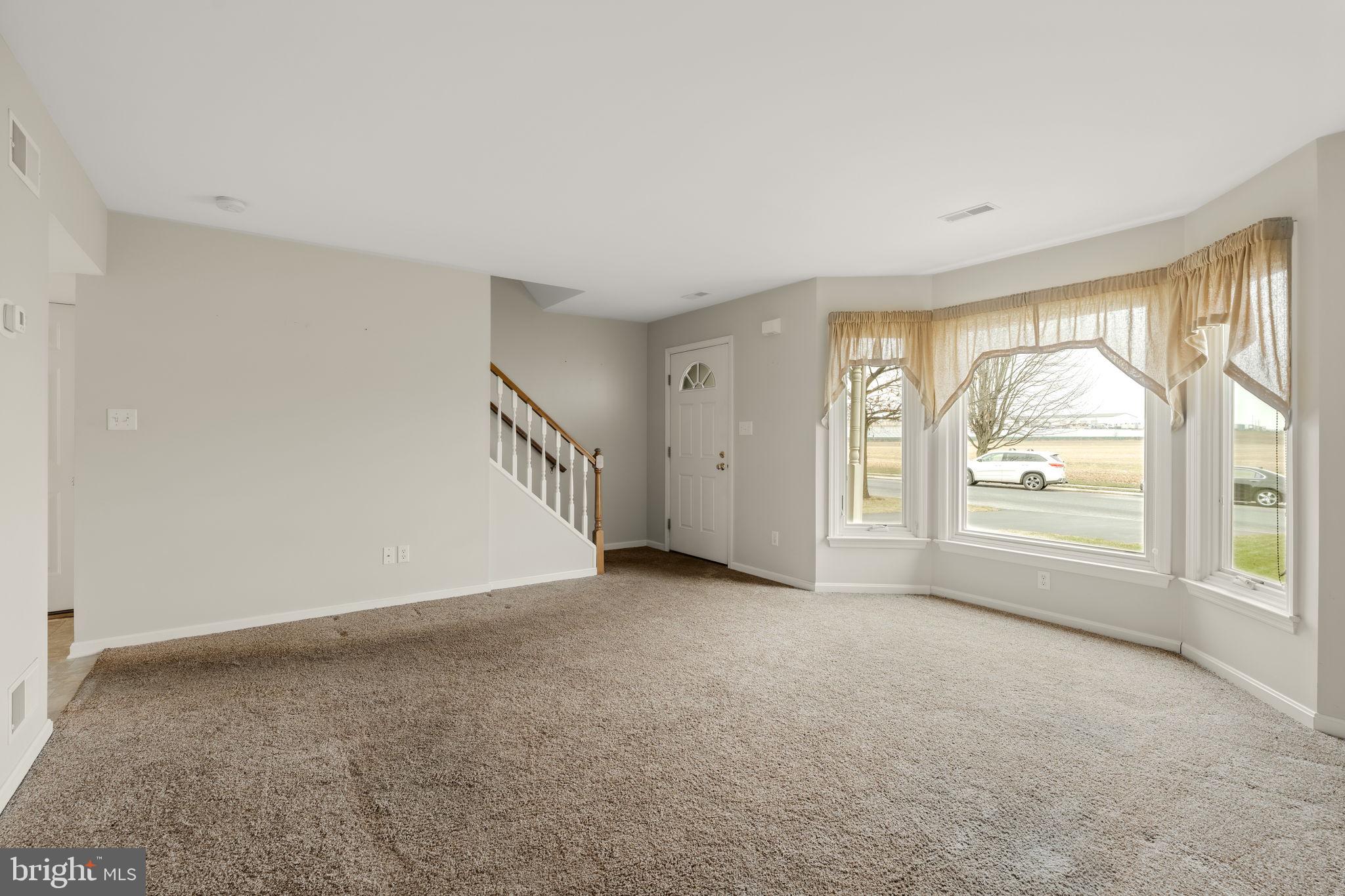136 Bridle Path New Holland, PA 17557 - Photo 4 of 38 a view of an empty room with a window