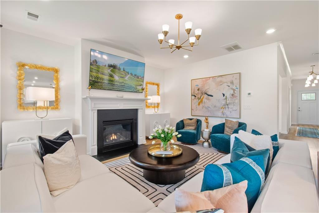 200 Chiswick Loop Stockbridge, GA 30281 - Photo 12 of 44 a living room with furniture and a fireplace