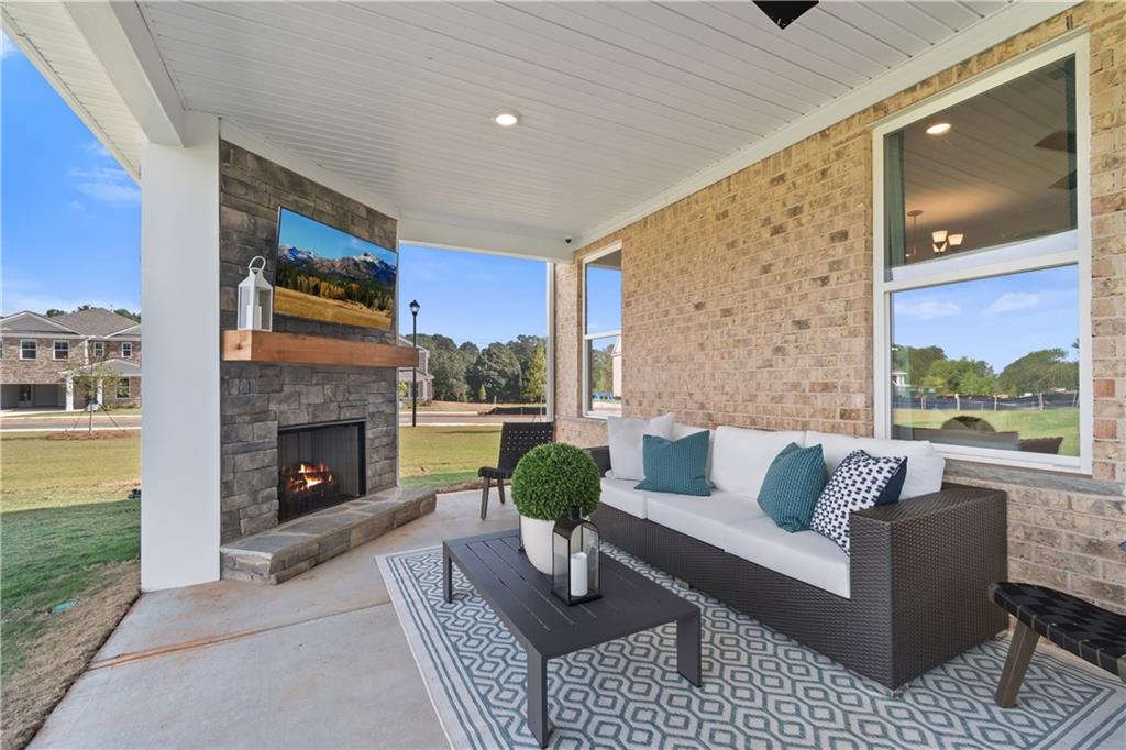 200 Chiswick Loop Stockbridge, GA 30281 - Photo 23 of 44 a living room with furniture and a fireplace